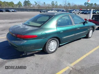 1999 Mercury Sable LS z VIN 1MEFM53S7XA612899, wystawiony jako IAAI lot #41687188 z przebiegiem 155 128 mil mil oraz . Historia ofert i sprzedaży dostępna na DreamBid. Obrazek 4.