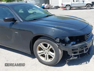 2015 Dodge Charger SE with VIN 2C3CDXBG9FH790573, listed as a IAAI auction lot 42142908 with 195,182 mi miles and . Bid and sale history available at carsss.com. Image 18.