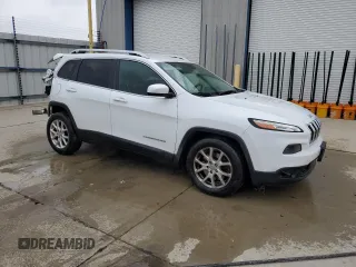 2015 Jeep Cherokee Latitude with VIN 1C4PJLCB9FW532301, listed as a Copart auction lot 52379335 with 153,845 mi miles and Salvage Title. Bid and sale history available at DreamBid. Image 4.