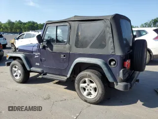 1999 Jeep Wrangler Sport with VIN 1J4FY19S6XP445867, listed as a Copart auction lot 62223125 with 146,037 mi miles and Salvage title. Bid and sale history available at DreamBid. Image 2.