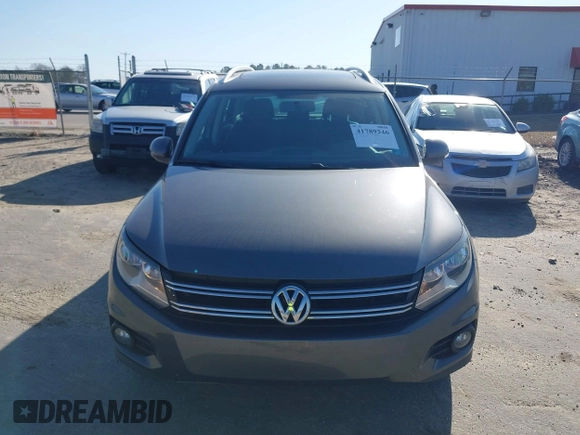 2012 Volkswagen Tiguan SE with VIN WVGAV7AX5CW000275, listed as a IAAI auction lot 41789246 with 123,618 mi miles and . Bid and sale history available at DreamBid. Image 6.