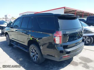 2021 Chevrolet Tahoe Z71 with VIN 1GNSKPKD2MR124128, listed as a IAAI auction lot 41874524 with 75,066 mi miles. Bid and sale history available at carsss.com. Image 3.