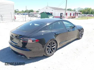 2021 Tesla Model S Plaid with VIN 5YJSA1E66MF452258, listed as a IAAI auction lot 41832000 with 42,845 mi miles and . Bid and sale history available at DreamBid. Image 4.
