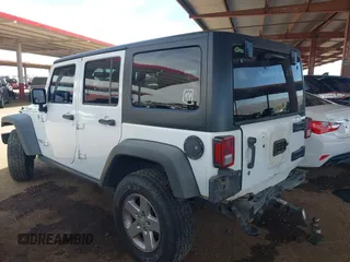 2015 Jeep Wrangler Unlimited Rubicon with VIN 1C4BJWFG9FL744927, listed as a IAAI auction lot 42169740 with 106,352 mi miles and . Bid and sale history available at DreamBid. Image 3.