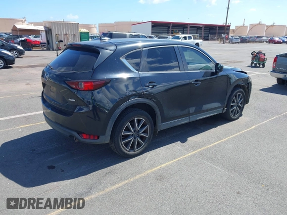 2018 Mazda CX-5 Touring z VIN JM3KFACM5J0309533, wystawiony jako IAAI lot #42195429 z przebiegiem 91 928 mil mil oraz . Historia ofert i sprzedaży dostępna na DreamBid. Obrazek 4.
