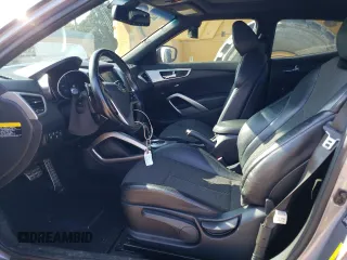 2016 Hyundai Veloster with VIN KMHTC6AD7GU248608, listed as a Copart auction lot 65809693 with 104,784 mi miles. Bid and sale history available at carsss.com. Image 7.