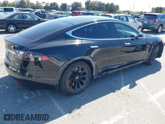 2017 Tesla Model S 100D with VIN 5YJSA1E21HF202591, listed as a IAAI auction lot 41983073 with 140,282 mi miles and . Bid and sale history available at DreamBid. Image 4.
