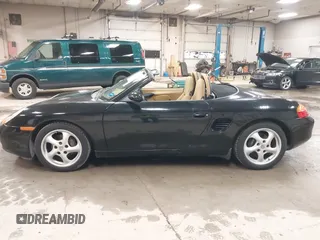 1999 Porsche Boxster z VIN WP0CA2984XU622814, wystawiony jako IAAI lot #42234977 z przebiegiem 52 404 mil mil oraz . Historia ofert i sprzedaży dostępna na DreamBid. Obrazek 12.
