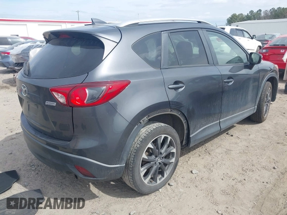 2016 Mazda CX-5 Grand Touring with VIN JM3KE4DY9G0845707, listed as a IAAI auction lot 41709685 with 96,351 mi miles. Bid and sale history available at carsss.com. Image 4.