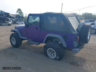 2004 Jeep Wrangler Sport with VIN 1J4FA49S14P782500, listed as a IAAI auction lot 41477451 with 92,263 mi miles. Bid and sale history available at carsss.com. Image 3.
