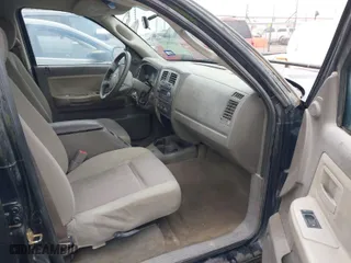 2006 Dodge Dakota SLT with VIN 1D7HE48N16S611010, listed as a IAAI auction lot 41018277 with 182,335 mi miles. Bid and sale history available at carsss.com. Image 5.