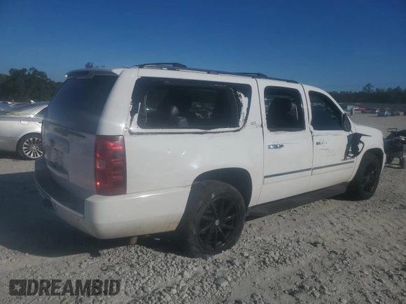 2014 Chevrolet Suburban LTZ with VIN 1GNSCKE02ER105377, listed as a Copart auction lot 76697154 with 229,461 mi miles and Salvage title. Bid and sale history available at DreamBid. Image 4.