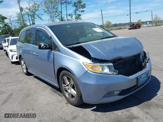 2013 Honda Odyssey Touring with VIN 5FNRL5H94DB069716, listed as a IAAI auction lot 41901369 with 243,492 mi miles. Bid and sale history available at carsss.com. Image 1.
