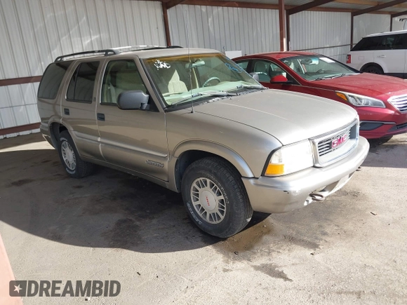 1999 GMC Jimmy SLE with VIN 1GKDT13W7X2529298, listed as a IAAI auction lot 41556249 with 114,750 mi miles. Bid and sale history available at carsss.com. Image 1.