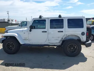 2017 Jeep Wrangler Unlimited Sahara with VIN 1C4BJWEG5HL588535, listed as a IAAI auction lot 42013571 with 70,012 mi miles. Bid and sale history available at carsss.com. Image 15.