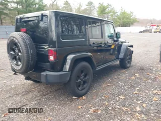 2015 Jeep Wrangler Unlimited Sahara with VIN 1C4HJWEG0FL661723, listed as a IAAI auction lot 41998393 with 89,077 mi miles. Bid and sale history available at carsss.com. Image 4.
