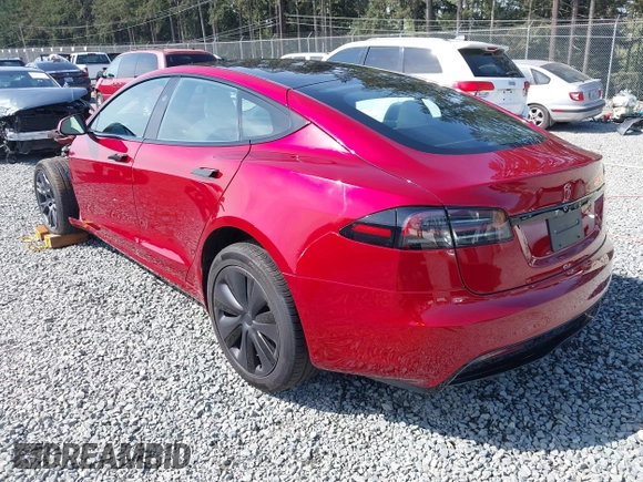 2023 Tesla Model S with VIN 5YJSA1E5XPF516779, listed as a IAAI auction lot 42110737 with 16,465 mi miles and . Bid and sale history available at DreamBid. Image 3.