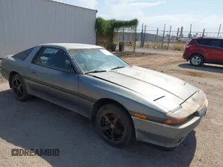 1991 Toyota Supra z VIN JT2MA70M2M0158753, wystawiony jako IAAI lot #42654427 z przebiegiem 90 885 mil mil oraz . Historia ofert i sprzedaży dostępna na DreamBid. Obrazek 1.