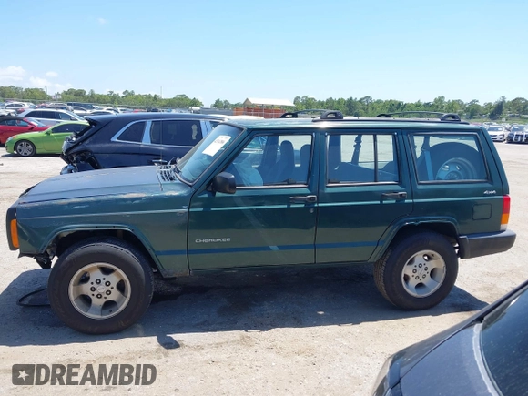 2000 Jeep Cherokee SE with VIN 1J4FF28S0YL236369, listed as a IAAI auction lot 42314386 with 159,005 mi miles and . Bid and sale history available at DreamBid. Image 14.