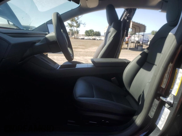 2025 Tesla Model 3 Long Range with VIN 5YJ3E1EA4SF978477, listed as a Copart auction lot 58525905 with 1,531 mi miles and Salvage title. Bid and sale history available at DreamBid. Image 7.
