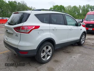 2016 Ford Escape SE with VIN 1FMCU9GX1GUC04085, listed as a IAAI auction lot 42126826 with 130,728 mi miles. Bid and sale history available at carsss.com. Image 4.