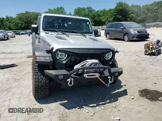 2022 Jeep Gladiator Rubicon z VIN 1C6JJTBG6NL104521, wystawiony jako Copart lot #57325365 z przebiegiem 31 498 mil mil oraz Szkoda całkowita • Salvage title. Historia ofert i sprzedaży dostępna na DreamBid. Obrazek 14.