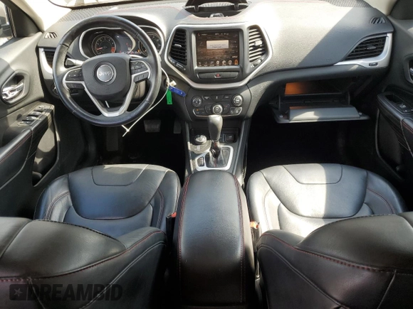 2014 Jeep Cherokee Trailhawk with VIN 1C4PJMBS4EW187085, listed as a Copart auction lot 64106985 with 166,467 mi miles and Clean title. Bid and sale history available at DreamBid. Image 8.
