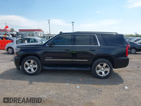 2015 Chevrolet Tahoe LT with VIN 1GNSCBKC9FR679748, listed as a IAAI auction lot 42018017 with 224,264 mi miles and . Bid and sale history available at DreamBid. Image 14.