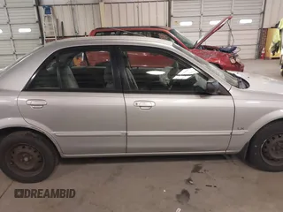 2000 Mazda Protege DX with VIN JM1BJ2226Y0206340, listed as a IAAI auction lot 41645396 with 238,500 mi miles and . Bid and sale history available at DreamBid. Image 13.