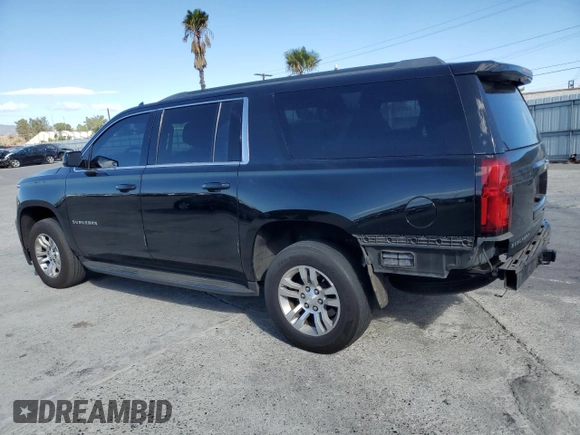 2017 Chevrolet Suburban LS with VIN 1GNSCGECXHR351539, listed as a Copart auction lot 87070214 with 246,129 mi miles and Salvage title. Bid and sale history available at DreamBid. Image 2.