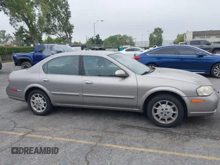 2000 Nissan Maxima GXE z VIN JN1CA31D0YT754624, wystawiony jako IAAI lot #42299290 z przebiegiem 81 958 mil mil oraz . Historia ofert i sprzedaży dostępna na DreamBid. Obrazek 13.