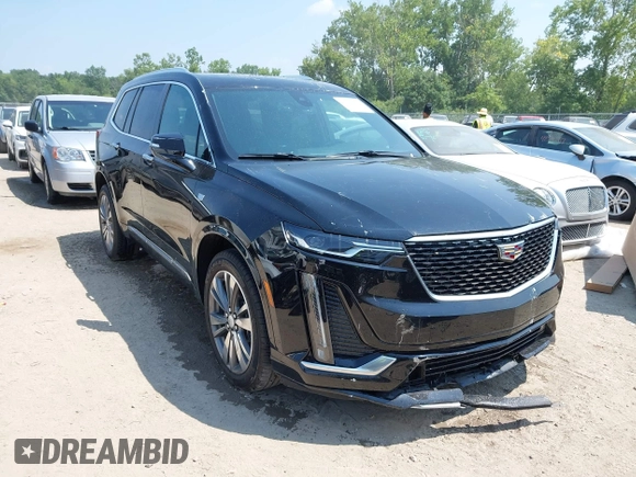 2021 Cadillac XT6 Premium Luxury with VIN 1GYKPDRS0MZ153523, listed as a IAAI auction lot 42770895 with 19,843 mi miles and . Bid and sale history available at DreamBid. Image 1.