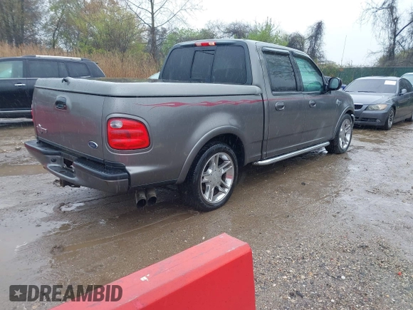 2002 Ford F-150 Harley Davidson with VIN 1FTRW07392KD29874, listed as a IAAI auction lot 41974230 with 163,279 mi miles. Bid and sale history available at carsss.com. Image 4.