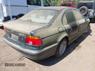 1997 BMW 5 Series 528iA with VIN WBADD6329VBW04841, listed as a IAAI auction lot 42038507 with 147,762 mi miles. Bid and sale history available at carsss.com. Image 4.