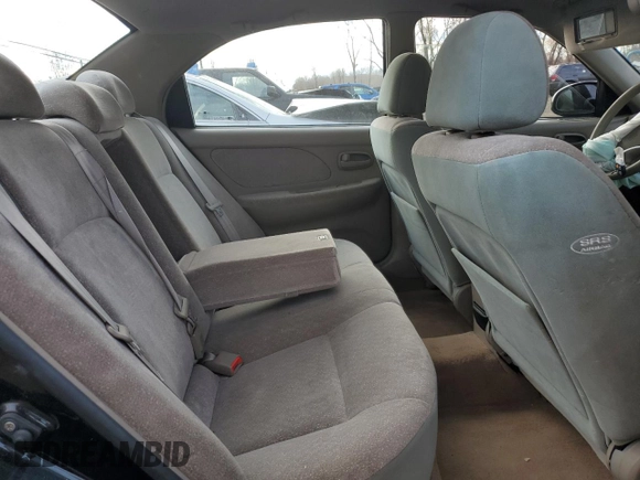 2001 Kia Optima LX z VIN KNAGD126315028712, wystawiony jako Copart lot #85302564 z przebiegiem 81 722 mil mil oraz Nie do naprawy • Non repairable. Historia ofert i sprzedaży dostępna na DreamBid. Obrazek 11.