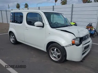 2010 Nissan Cube S z VIN JN8AZ2KRXAT161347, wystawiony jako IAAI lot #41921669 z przebiegiem 161 121 mil mil oraz . Historia ofert i sprzedaży dostępna na DreamBid. Obrazek 1.