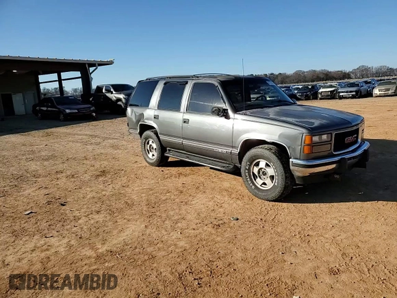 1999 GMC Yukon with VIN 1GKEK13R3XJ750307, listed as a Copart auction lot 84728104 with 212,879 mi miles and Salvage Title. Bid and sale history available at carsss.com. Image 11.