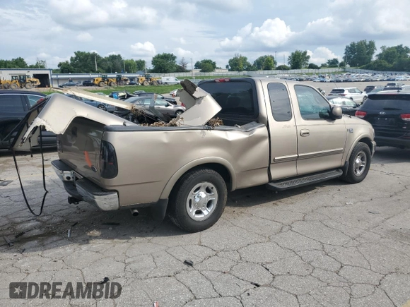 2002 Ford F-150 XL with VIN 1FTRX17L02KC02580, listed as a Copart auction lot 60859595 with 175,892 mi miles and Salvage title. Bid and sale history available at DreamBid. Image 3.