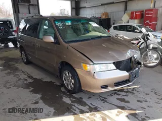 2004 Honda Odyssey EX-L with VIN 5FNRL18794B074711, listed as a IAAI auction lot 41333406 with 164,463 mi miles and . Bid and sale history available at DreamBid. Image 1.