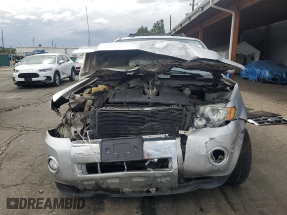 2010 Ford Escape Limited с VIN 1FMCU9EG0AKD42965, выставлен на аукционе Copart как лот 57097545 с пробегом 153 370 миль миль и Списание • Salvage title. История ставок и продаж доступна на DreamBid. Изображение 5.