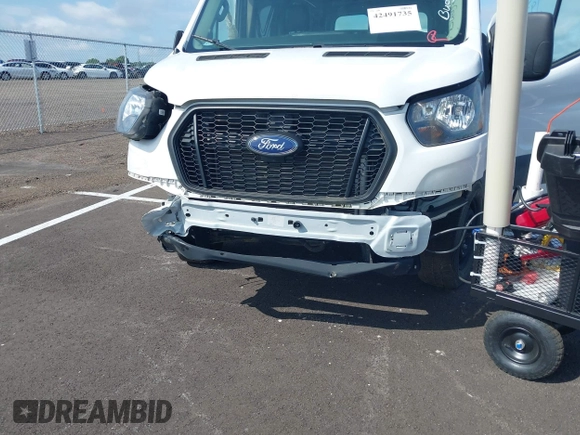 2022 Ford Transit Cargo with VIN 1FTBR1C83NKA81478, listed as a IAAI auction lot 42491735 with 12,902 mi miles and . Bid and sale history available at DreamBid. Image 6.