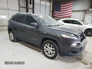 2015 Jeep Cherokee Latitude with VIN 1C4PJMCS7FW504728, listed as a Copart auction lot 81674984 with 144,342 mi miles and Salvage Title. Bid and sale history available at carsss.com. Image 4.