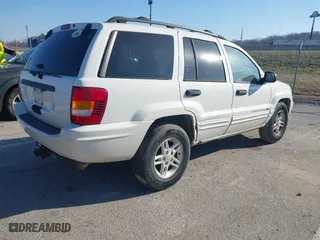 2004 Jeep Grand Cherokee Laredo with VIN 1J4GX48S84C206933, listed as a IAAI auction lot 41739364 with 257,893 mi miles. Bid and sale history available at carsss.com. Image 4.