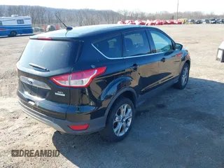2013 Ford Escape SEL with VIN 1FMCU9HX5DUC58726, listed as a IAAI auction lot 41766493 with 219,093 mi miles. Bid and sale history available at carsss.com. Image 4.