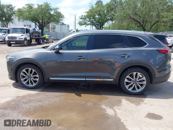 2016 Mazda CX-9 Signature with VIN JM3TCBEY9G0100579, listed as a IAAI auction lot 42282293 with 142,700 mi miles and . Bid and sale history available at DreamBid. Image 14.