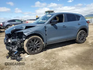2024 Mazda CX-5 2.5 S Carbon Edition with VIN JM3KFBCL6R0422979, listed as a Copart auction lot 50939695 with 9,974 mi miles and Salvage Title. Bid and sale history available at carsss.com. Image 1.