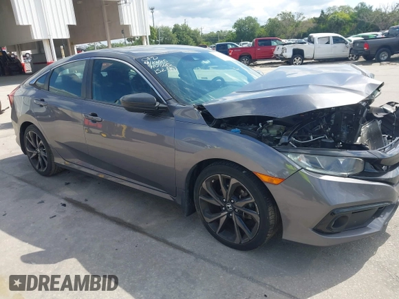 2019 Honda Civic Sedan Sport with VIN 19XFC2F8XKE035939, listed as a IAAI auction lot 42032928 with 84,414 mi miles. Bid and sale history available at carsss.com. Image 1.