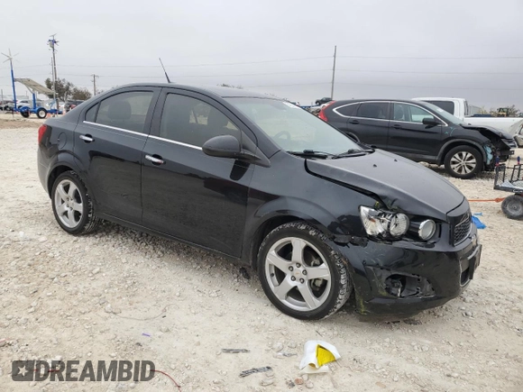 2012 Chevrolet Sonic LTZ z VIN 1G1JE5SB2C4173638, wystawiony jako Copart lot #84634474 z przebiegiem 148 247 mil mil oraz Szkoda całkowita • Salvage title. Historia ofert i sprzedaży dostępna na DreamBid. Obrazek 4.