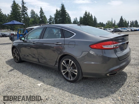 2017 Ford Fusion Titanium z VIN 3FA6P0K95HR139060, wystawiony jako Copart lot #62200755 z przebiegiem 106 133 mil mil oraz Szkoda całkowita • Salvage title. Historia ofert i sprzedaży dostępna na DreamBid. Obrazek 2.
