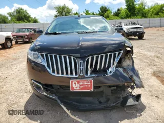 2015 Lincoln MKX z VIN 2LMDJ8JK1FBL31836, wystawiony jako Copart lot #56241005 z przebiegiem 128 613 mil mil oraz Szkoda całkowita • Salvage title. Historia ofert i sprzedaży dostępna na DreamBid. Obrazek 5.